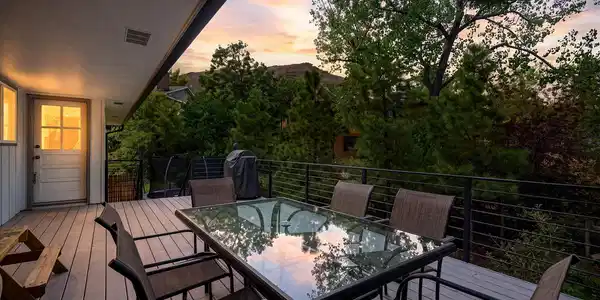 Image 3: Sunset dinners on the deck with the foothills as the backdrop. Image 3: Sunset dinners on the deck with the foothills as the backdrop.