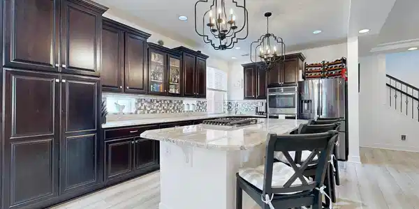 Image 2: Designer upgrades cabinets with Crown Molding, Gas Cook Top center of Island, 2 Double Ovens, with Pantry long the walk. Image 2: Designer upgrades cabinets with Crown Molding, Gas Cook Top center of Island, 2 Double Ovens, with Pantry long the walk.