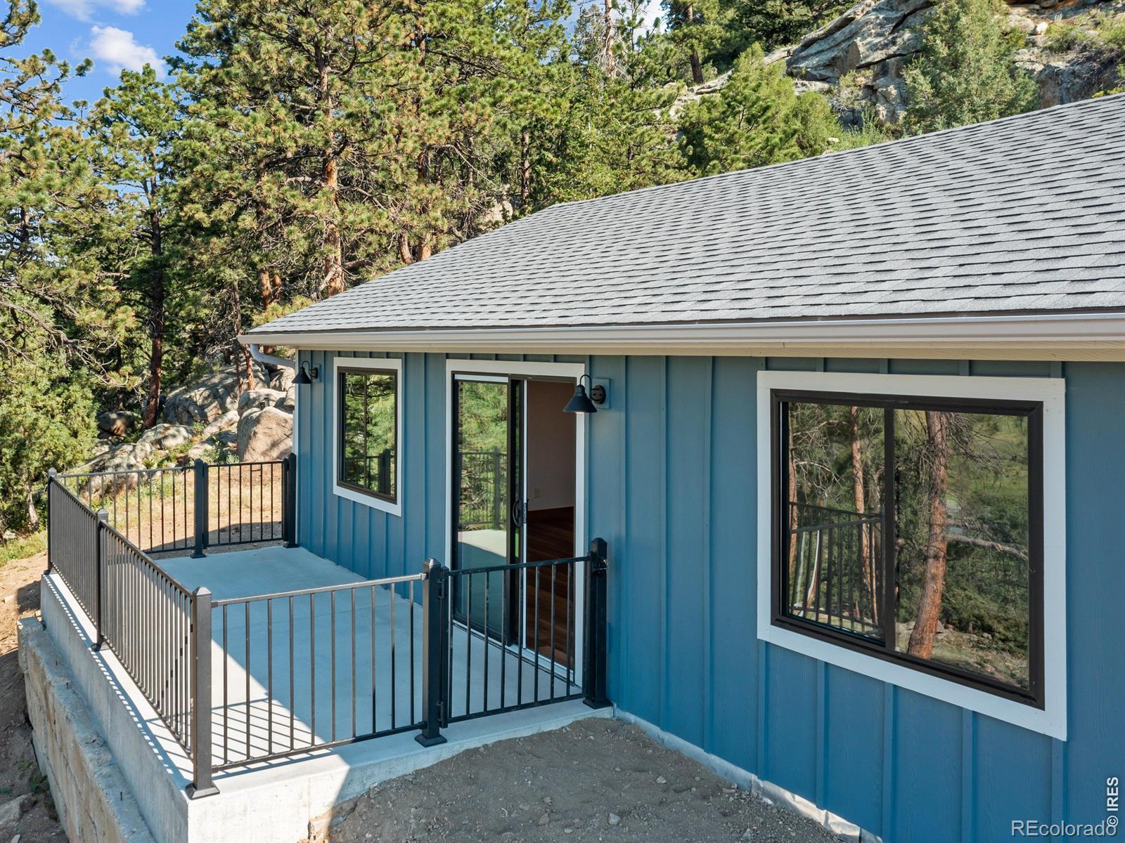 Image 2: New roof, siding, windows, concrete, gutters, driveway, cistern pump, and deck railing Image 2: New roof, siding, windows, concrete, gutters, driveway, cistern pump, and deck railing