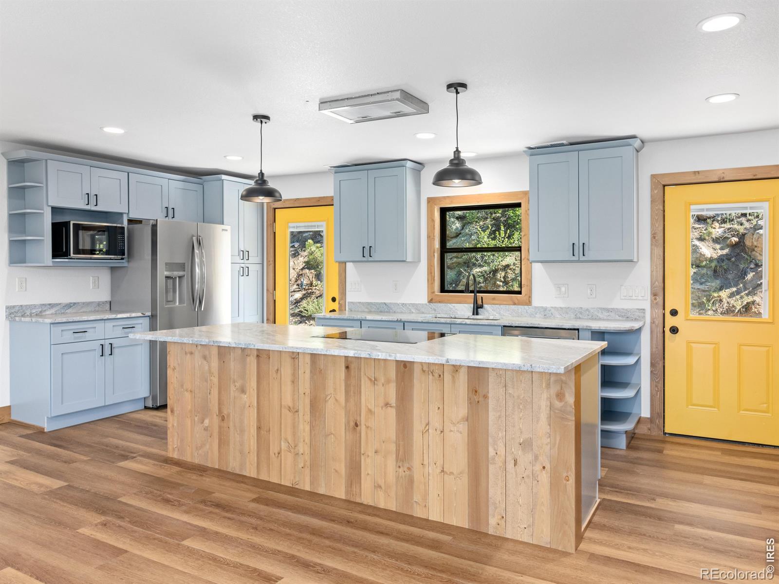 Image 4: At the heart of the home is a state-of-the-art kitchen with all-new stainless steel appliances and a large center island with breakfast bar seating Image 4: At the heart of the home is a state-of-the-art kitchen with all-new stainless steel appliances and a large center island with breakfast bar seating