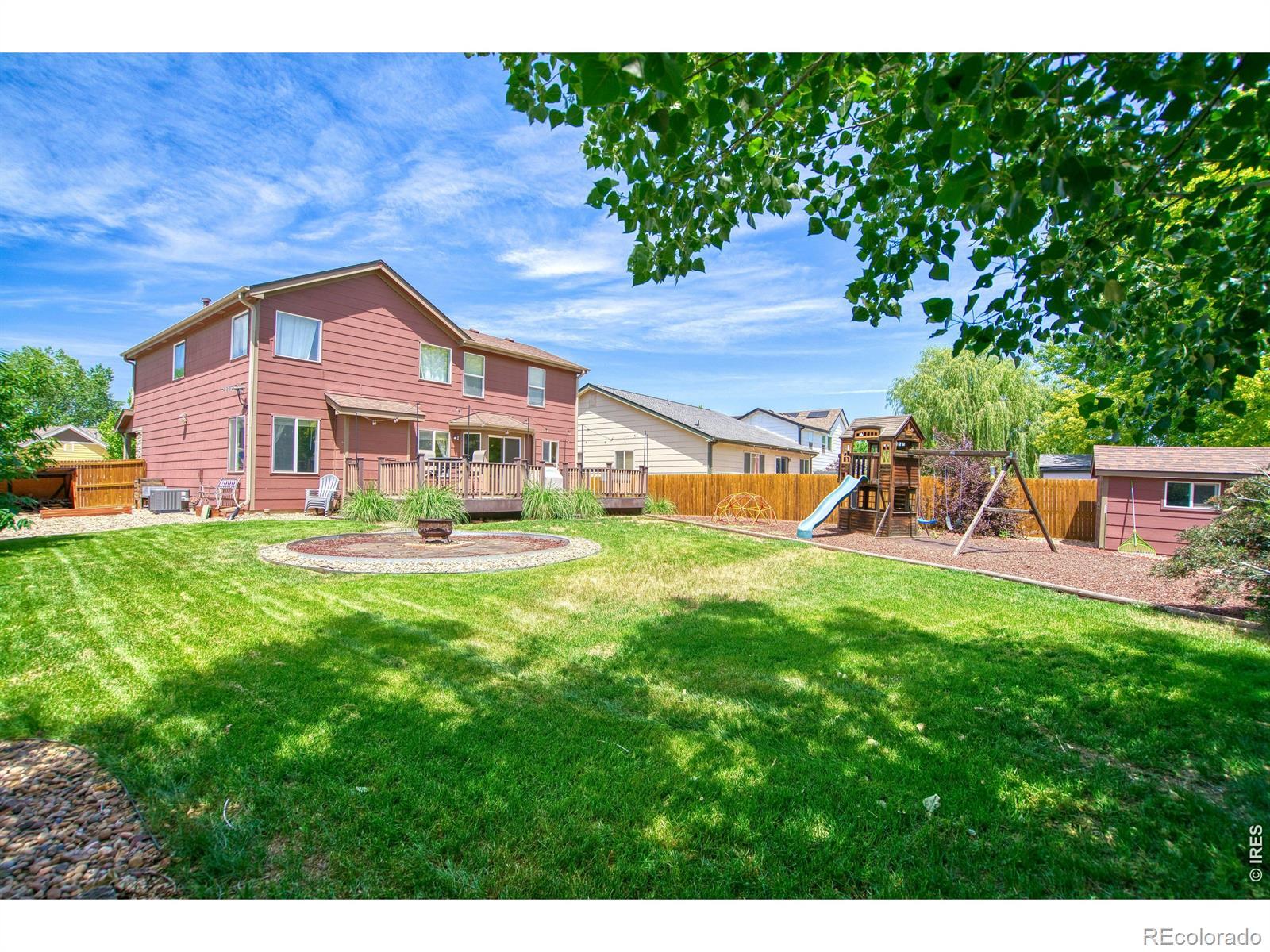 Image 2: Backyard with fire pit and storage shed Image 2: Backyard with fire pit and storage shed