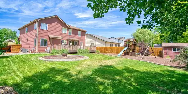 Image 2: Backyard with fire pit and storage shed Image 2: Backyard with fire pit and storage shed