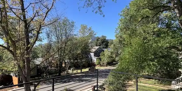 Image 4: Upper south facing deck with partial views in the Summer and full views in the Winter!