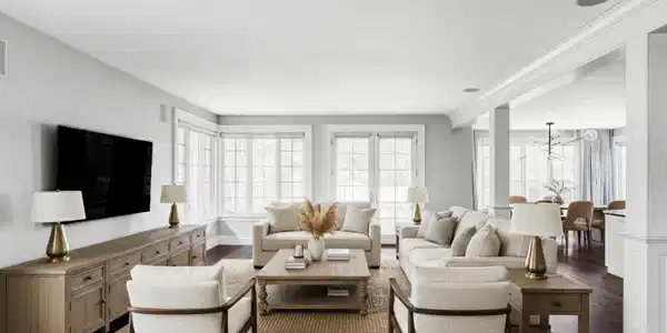 Image 3: Toward the back of the home, the family room flows into the kitchen, where an oversized island, premium appliances, and a sunny dining nook create the natural hub of daily life. (Photo is virtually staged)