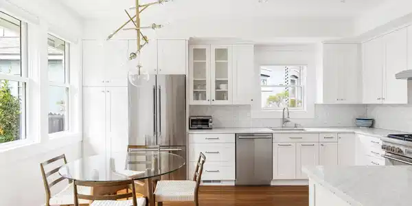Image 4: The bright kitchen and dining area pair classic proportions with clean contemporary finishes and abundant natural light.