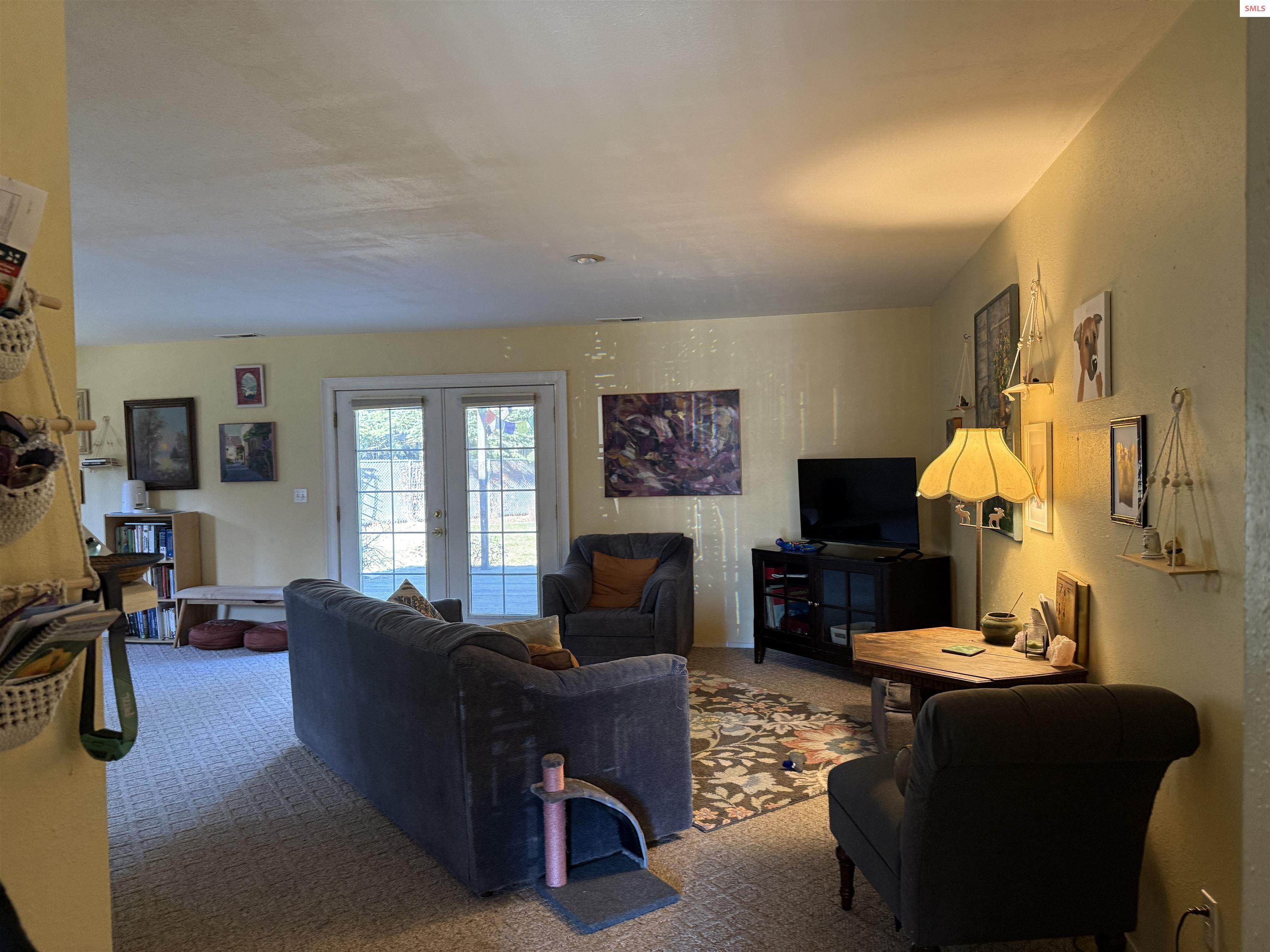 Image 3: Living room open to back deck