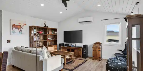 Image 3: Ceiling fan, vaulted ceiling, lots of windows and natural light with mountain and sunset views.