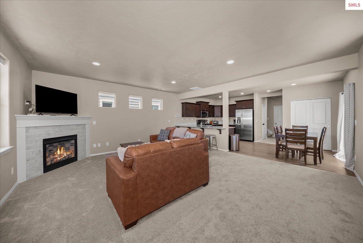 Image 4: Large great room that opens to kitchen and dining with Gas Fireplace