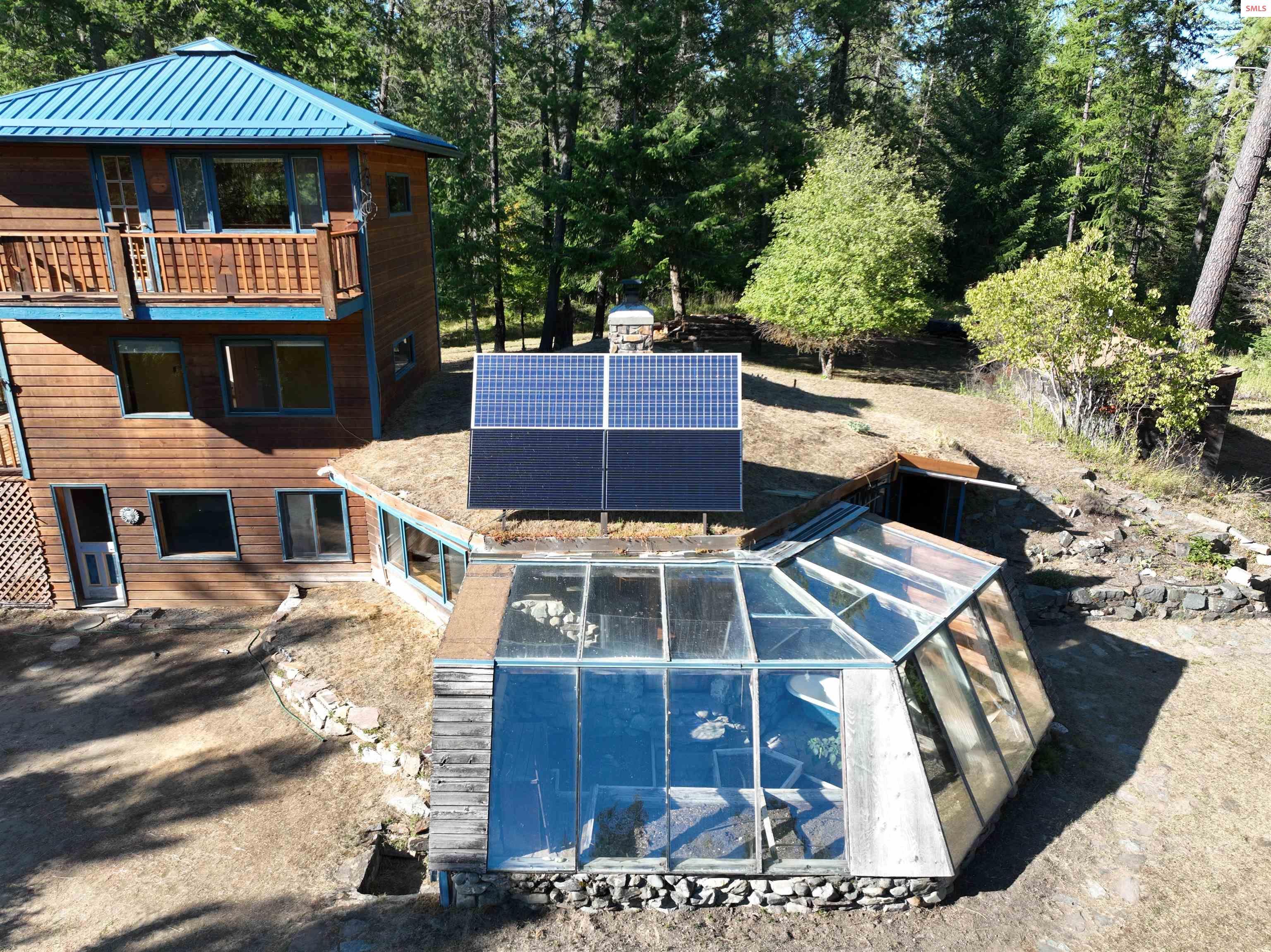 Image 4: Power from the sun! 2 200 watt solar panels and 2 310 watt solar panels to power the house.