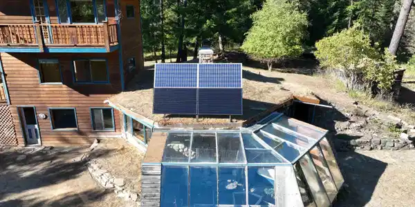 Image 4: Power from the sun! 2 200 watt solar panels and 2 310 watt solar panels to power the house.