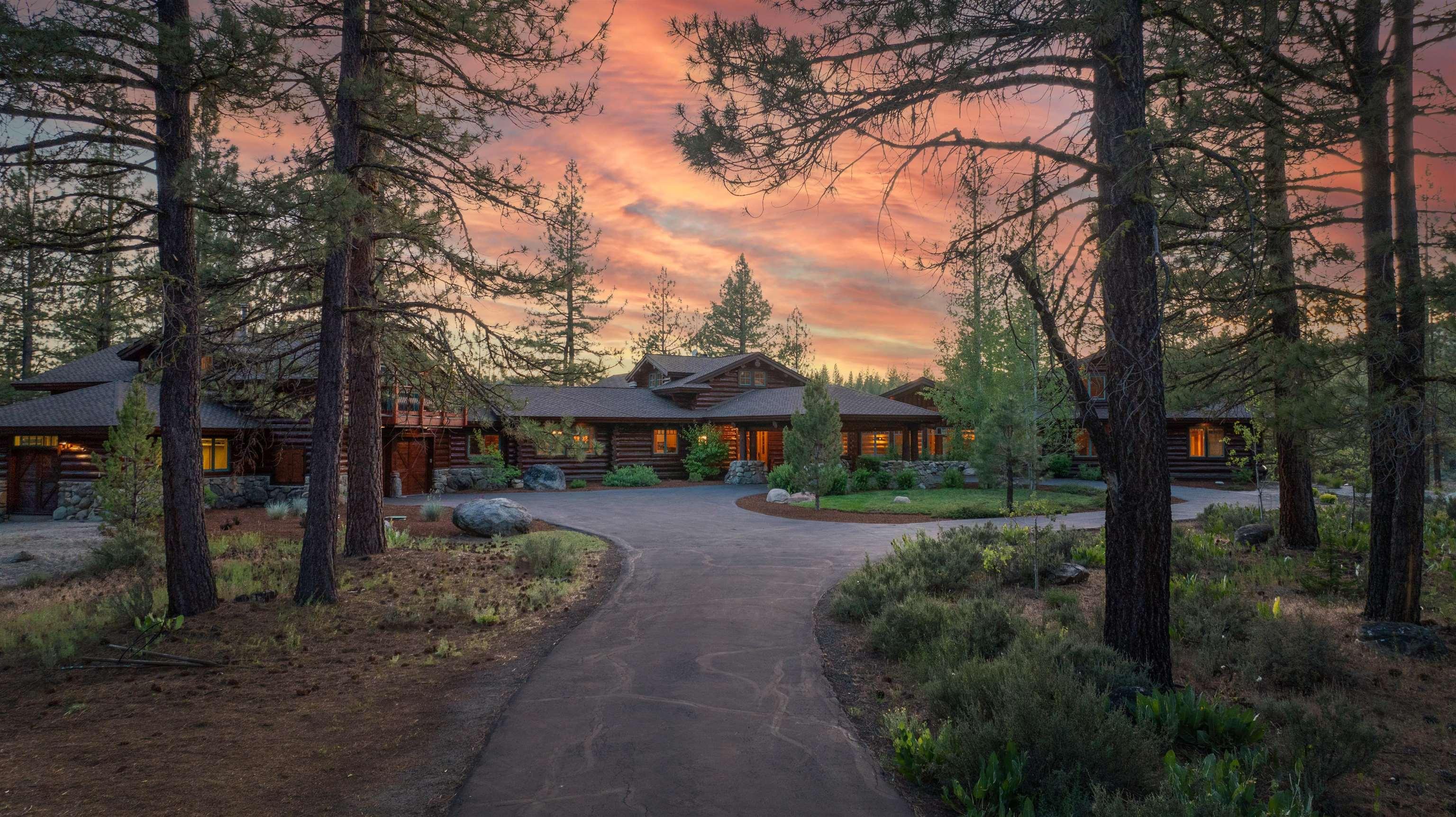 Image 0: Enter this luxury estate via private gate. The Porte Cochere offers a welcoming entrance for guests., Front of the Estate