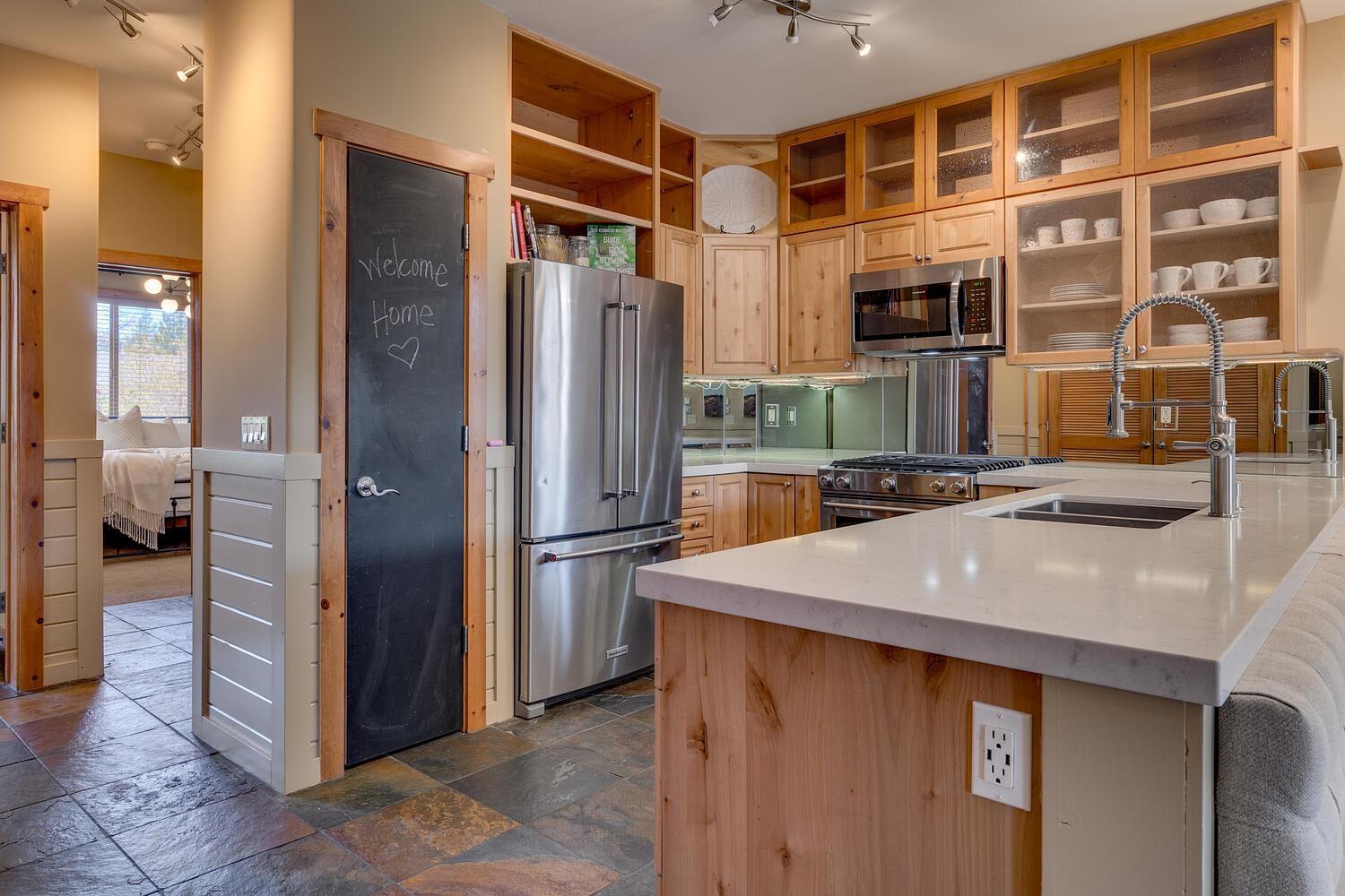 Image 2: Custom designed with additional cabinetry and new countertops and backsplash