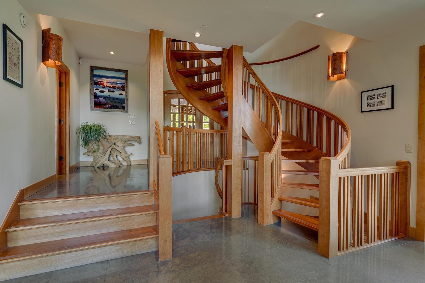 Image 3: There is a powder room just off the entry., Entry Stairs