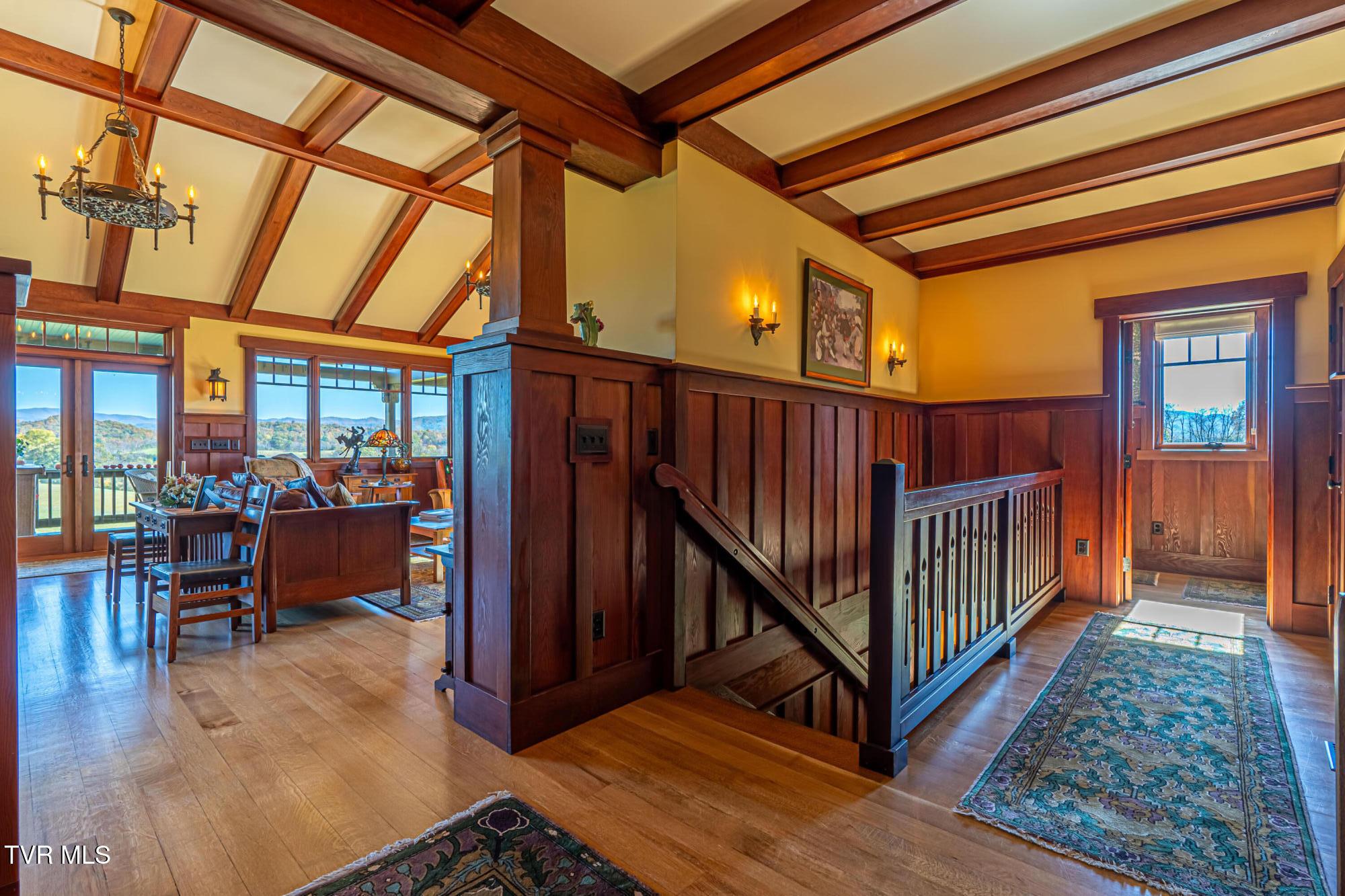 Image 3: Foyer with fir trim and beams