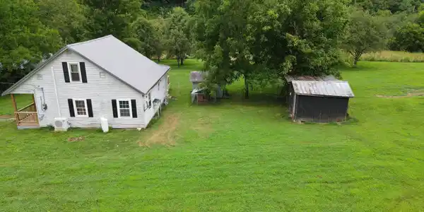 Image 3: LEFT SIDE VIEW WITH WELL HOUSE