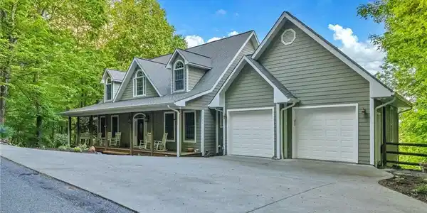 Image 2: Paved private road transitions to concrete pad