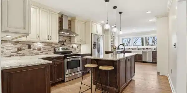 Image 3: Chef's Kitchen! TONS of counterspace, pot filler over stove top, prep sink in island plus farmhouse sink with beautiful backyard view! Plenty of space for friends and family to gather.
