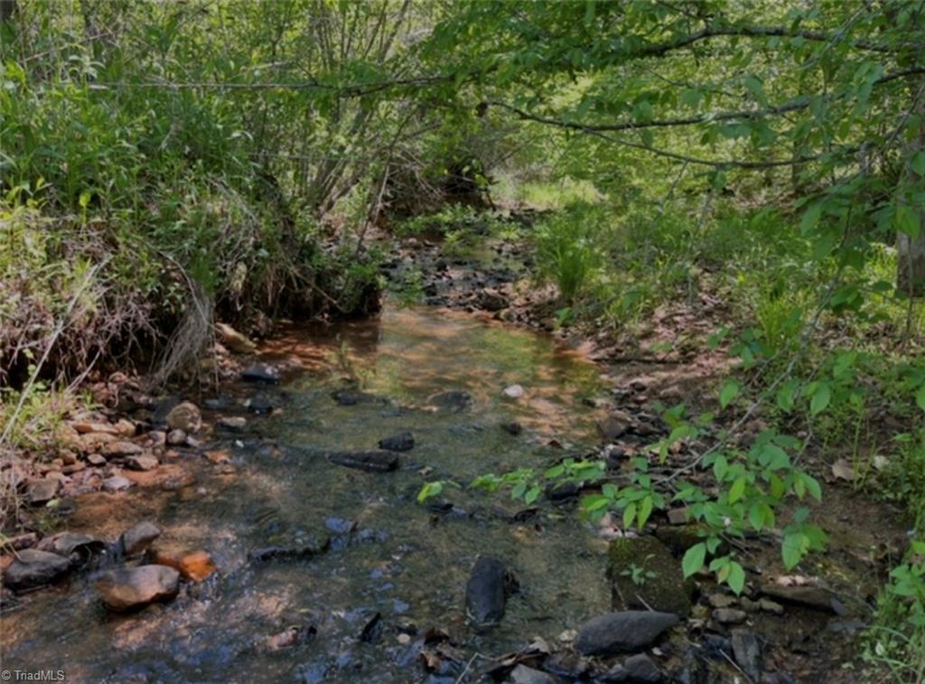 Image 2: Beautiful creek through the property!