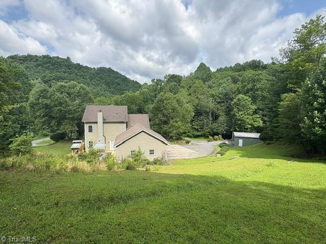 Image 4: Back of house and yard