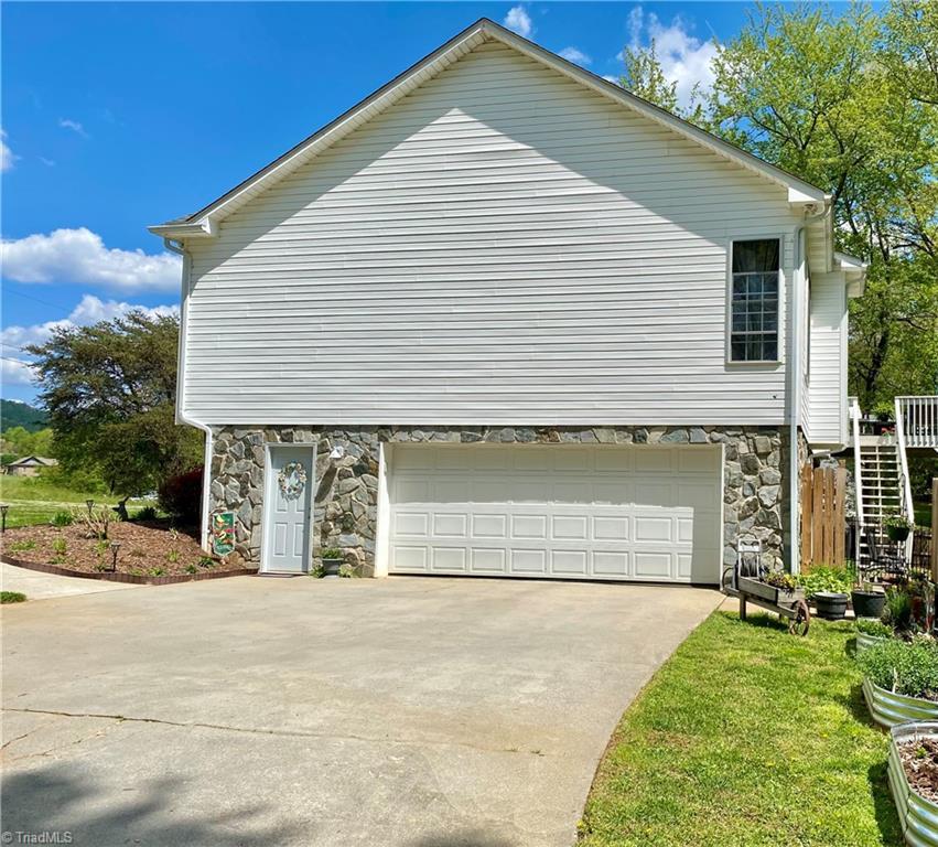 Image 2: Has oversized garage and a walk out door- tons of storage in this Portion of the basement