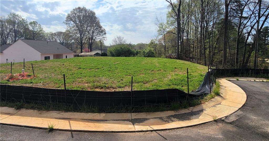 Image 3: Cleared lot, ready for construction. See Completion Date.