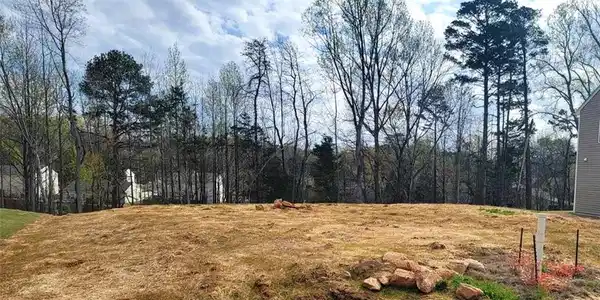 Image 3: Cleared lot, ready for construction. See Completion Date.