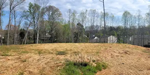 Image 2: Cleared lot, ready for construction. See Completion date.