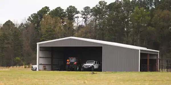 Image 4: Expansive metal outbuilding featuring a gray corru
