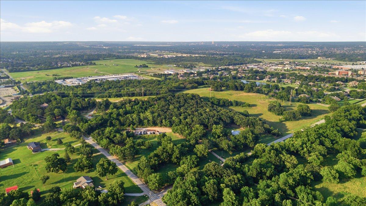 Image 2: Expansive aerial view showcasing a verdant landsca