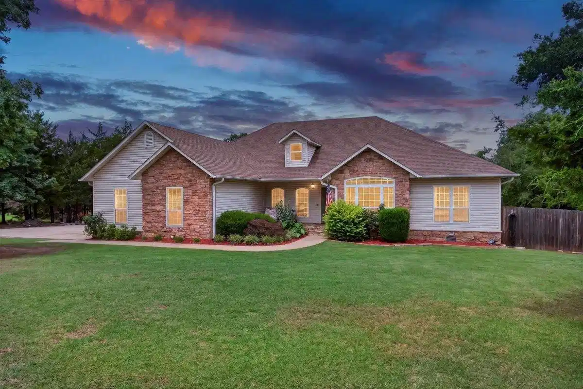 Image 1: Traditional-style residence featuring a combinatio