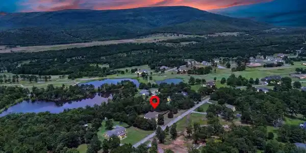 Image 2: Rural residential property surrounded by mature tr