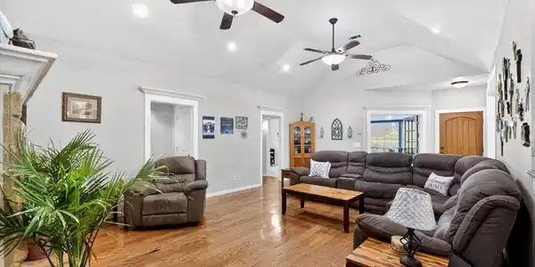 Image 4: Spacious room featuring vaulted ceilings, recessed