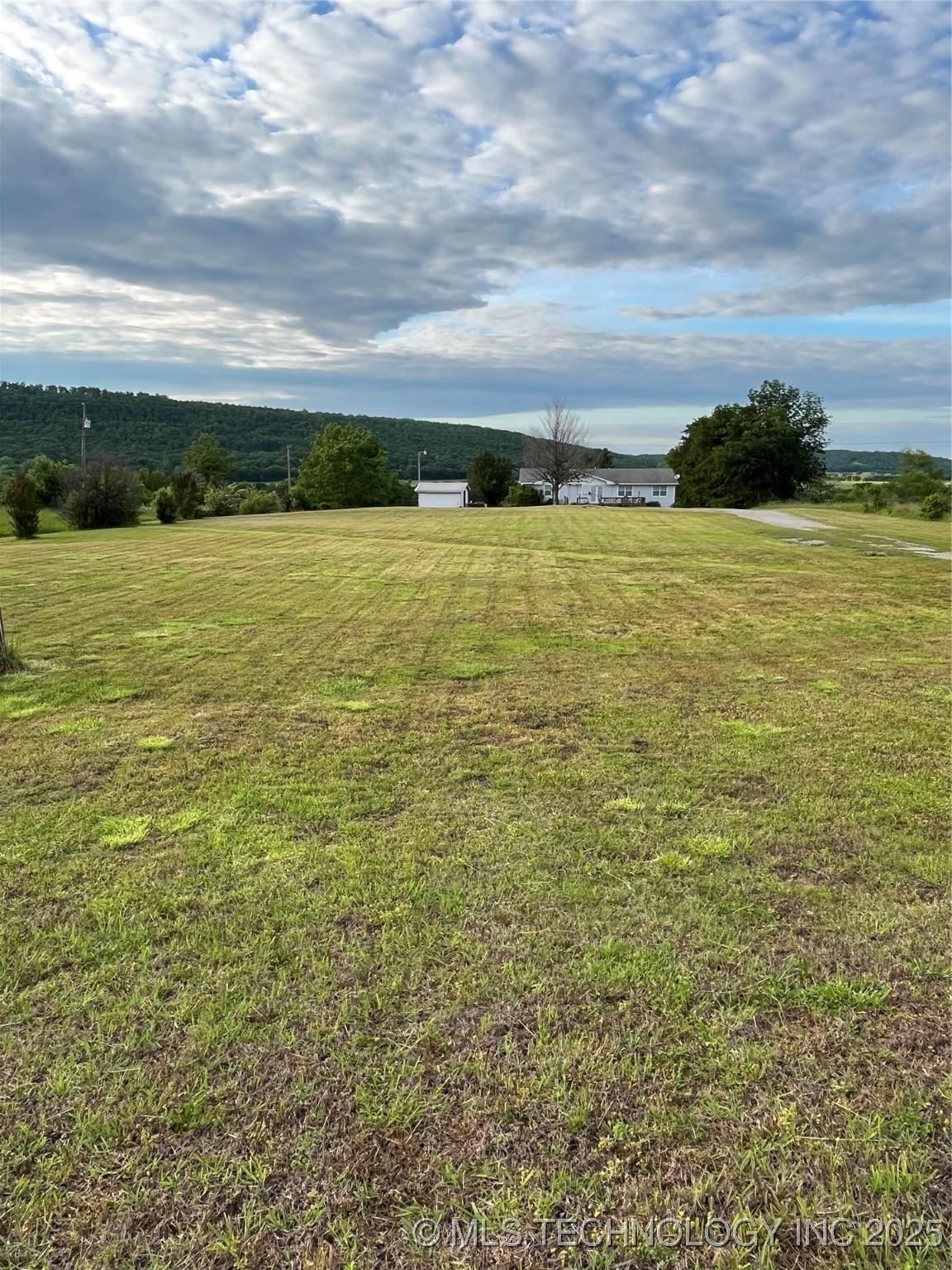 Image 2: View of grassy yard with a view of countryside