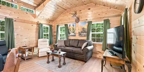 Image 4: Vaulted wood-paneled ceiling with exposed beams, w