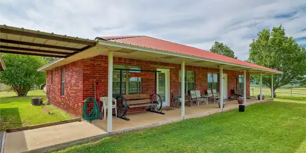 Image 2: Front of home, walkway to carport