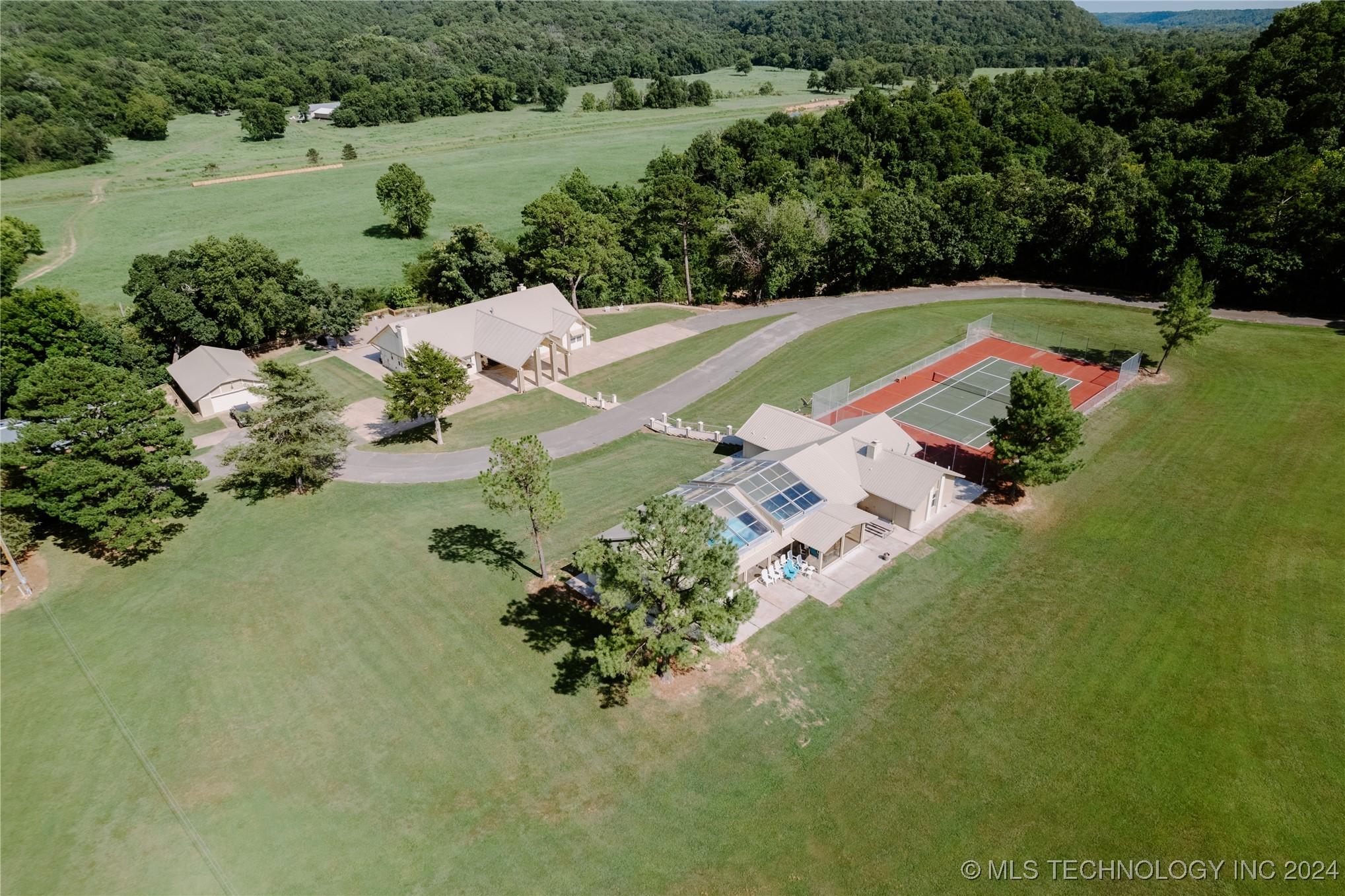 Image 1: View of Main House, Pool House, Shop & Garage