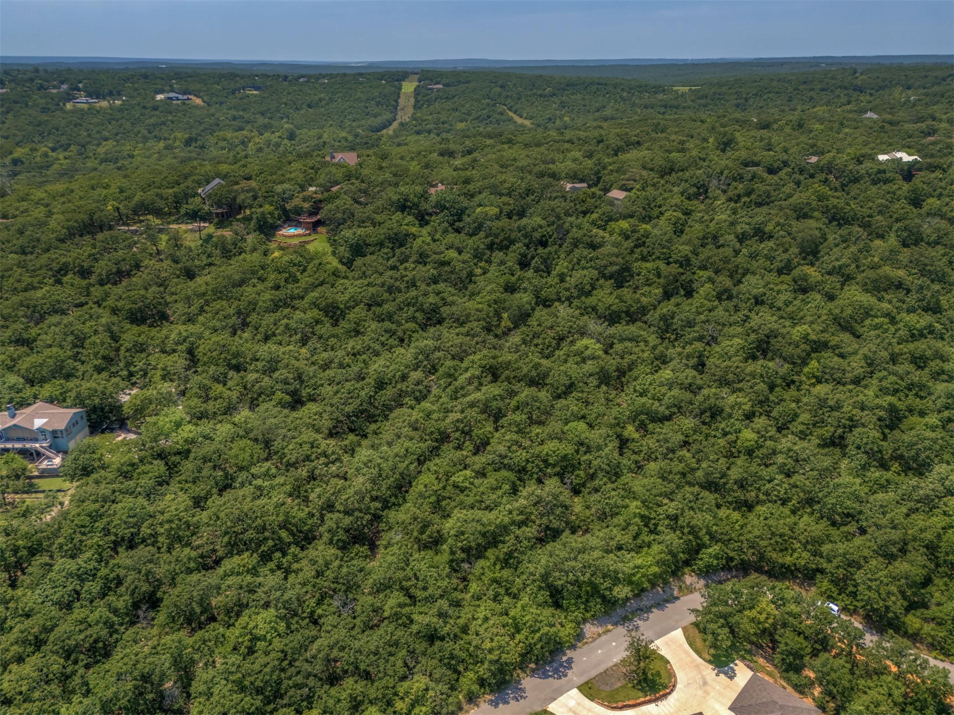 Image 3: Expansive, wooded landscape featuring mature decid