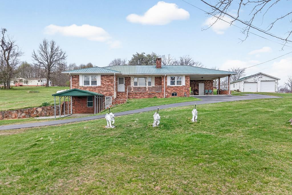 Image 2: House and garage