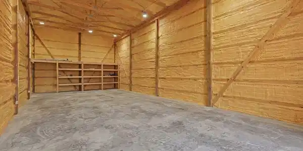 Image 3: Inside Blue Building, This is a picture of the inside of the building before the insulation was added.