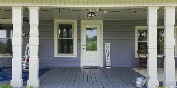 Image 4: An inviting covered porch features classic columns