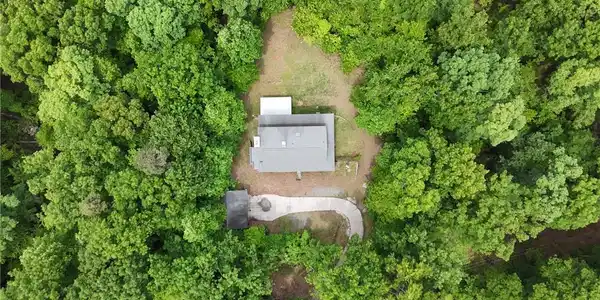 Image 3: This aerial view showcases a private residence nes