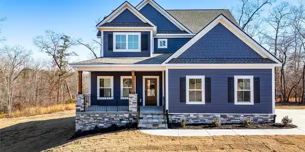 Image 2: This inviting residence features a welcoming porch
