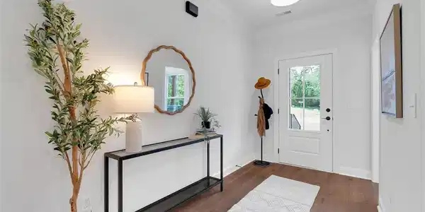 Image 3: Rich wood floors and elegant crown molding define