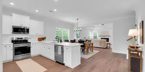 Image 4: Hardwood floors and recessed lighting anchor this