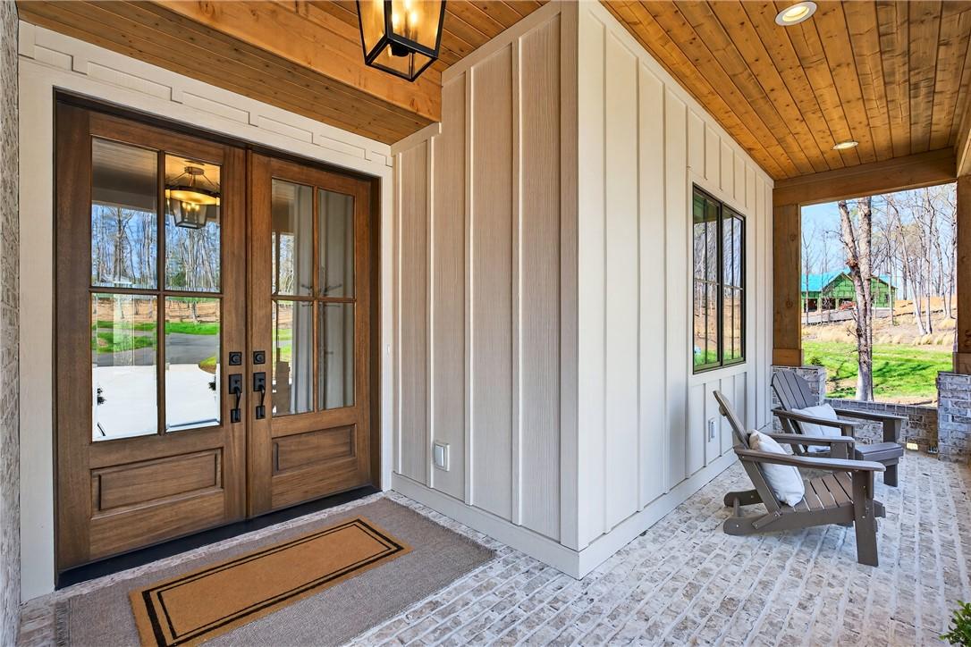 Image 3: Entertain guests on this welcoming porch, showcasi