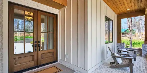 Image 3: Entertain guests on this welcoming porch, showcasi