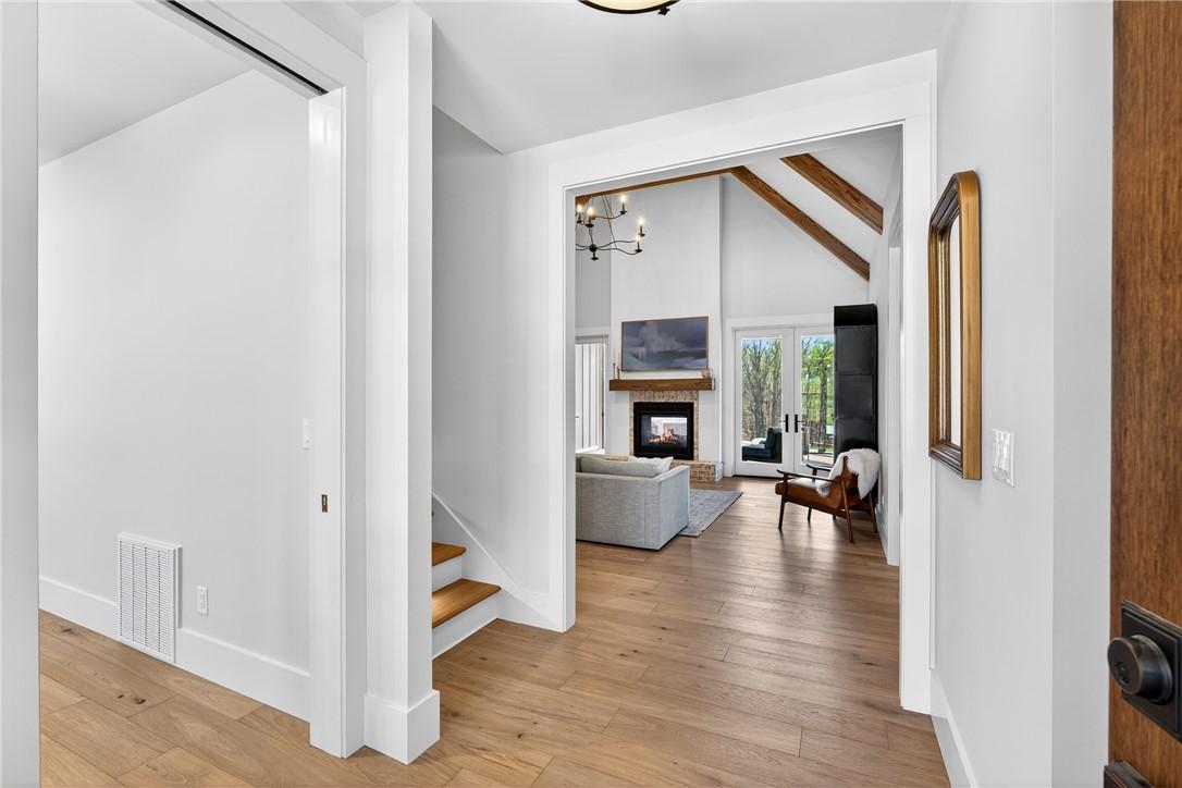 Image 4: This inviting entryway seamlessly connects to a sp