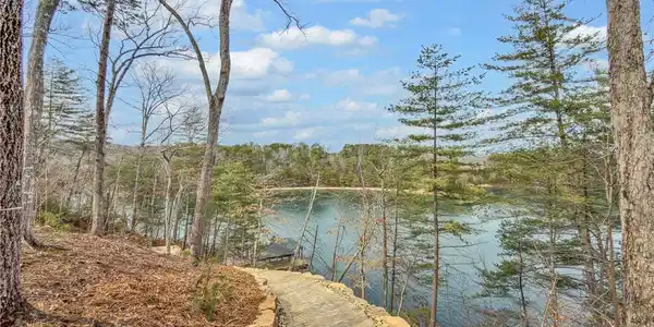 Image 4: A picturesque pathway winds through a natural land