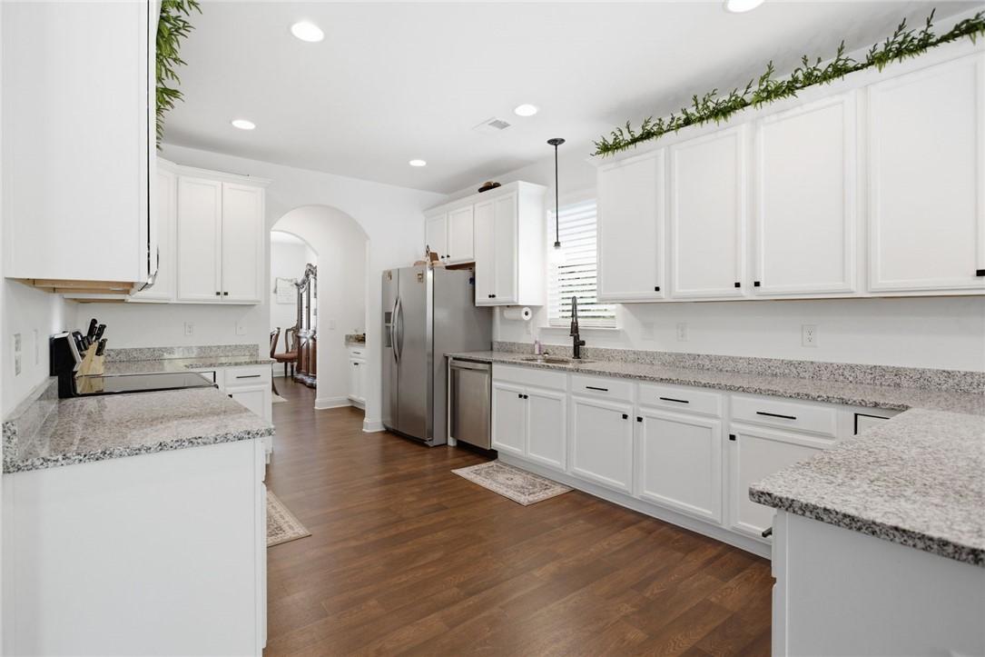 Image 2: This kitchen showcases a functional layout, ample