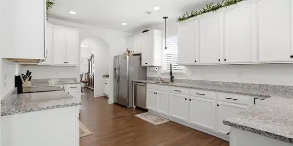 Image 2: This kitchen showcases a functional layout, ample